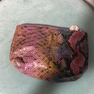 A little bag that can be used as a nail polish kit wallet and etc.